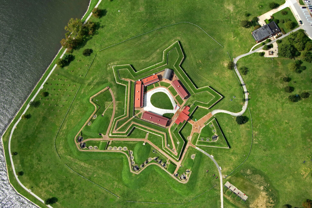 Aerial view of Fort McHenry, showcasing the strategic layout and defensive features of the fort, with its distinctive star-shaped design and expansive grounds, providing a unique perspective of this historic landmark in Baltimore, Maryland.