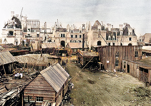 the Biltmore Estate during its construction phase, showcasing the majestic structure taking shape with scaffolding, construction materials, and workers, providing a glimpse into the meticulous craftsmanship and labor that went into creating this iconic architectural masterpiece