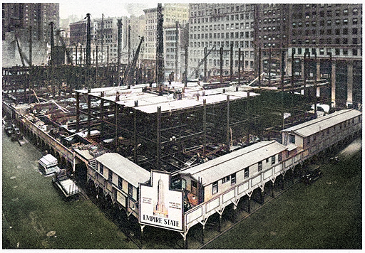 foundation construction of the Empire State Building, showcasing the excavation and construction processes, workers and machinery, as the groundwork is laid for this iconic skyscraper, a testament to engineering marvel and architectural innovation.